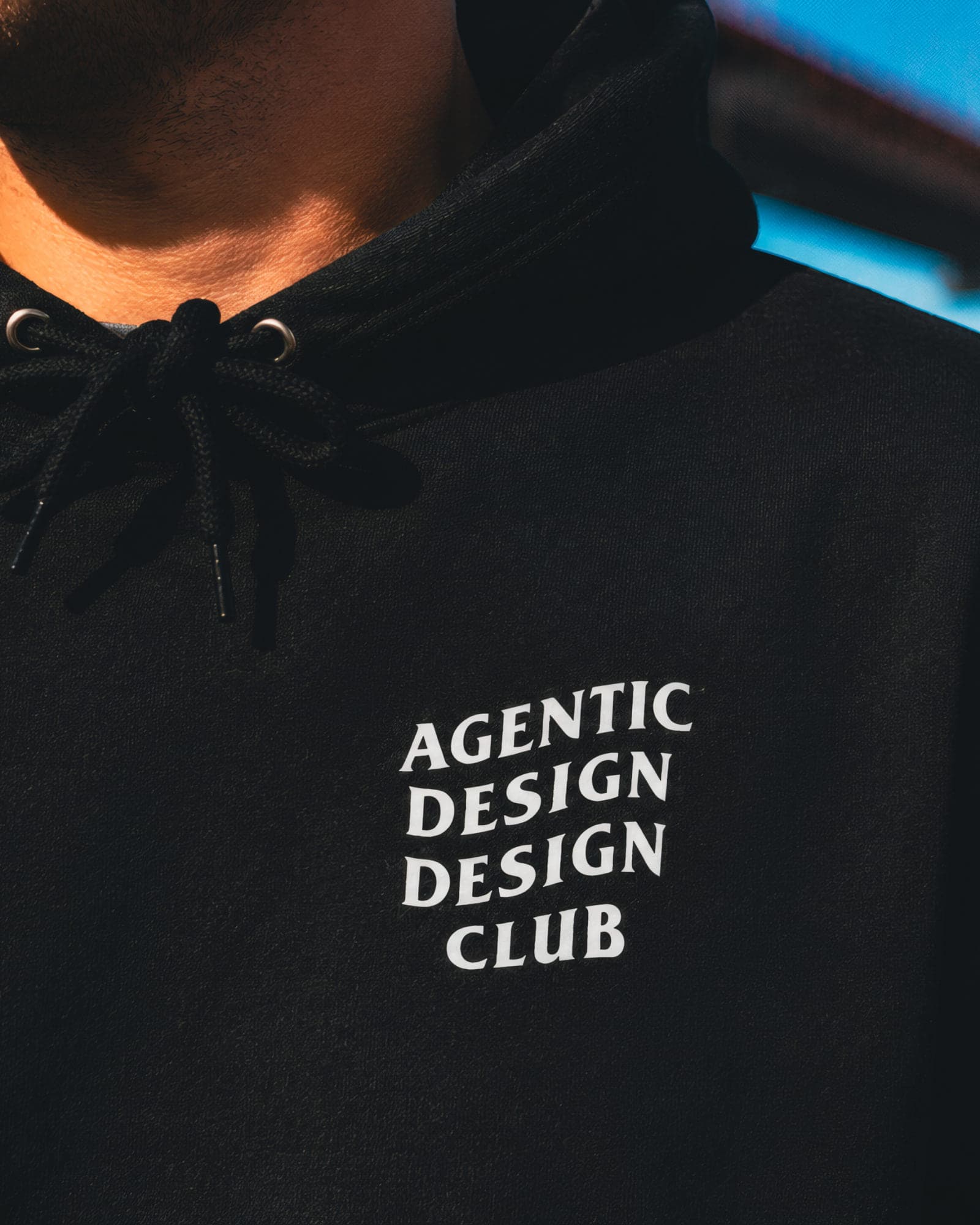 Close-up of the Agentic Design Design Club chest print